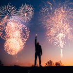 person celebrating with fireworks